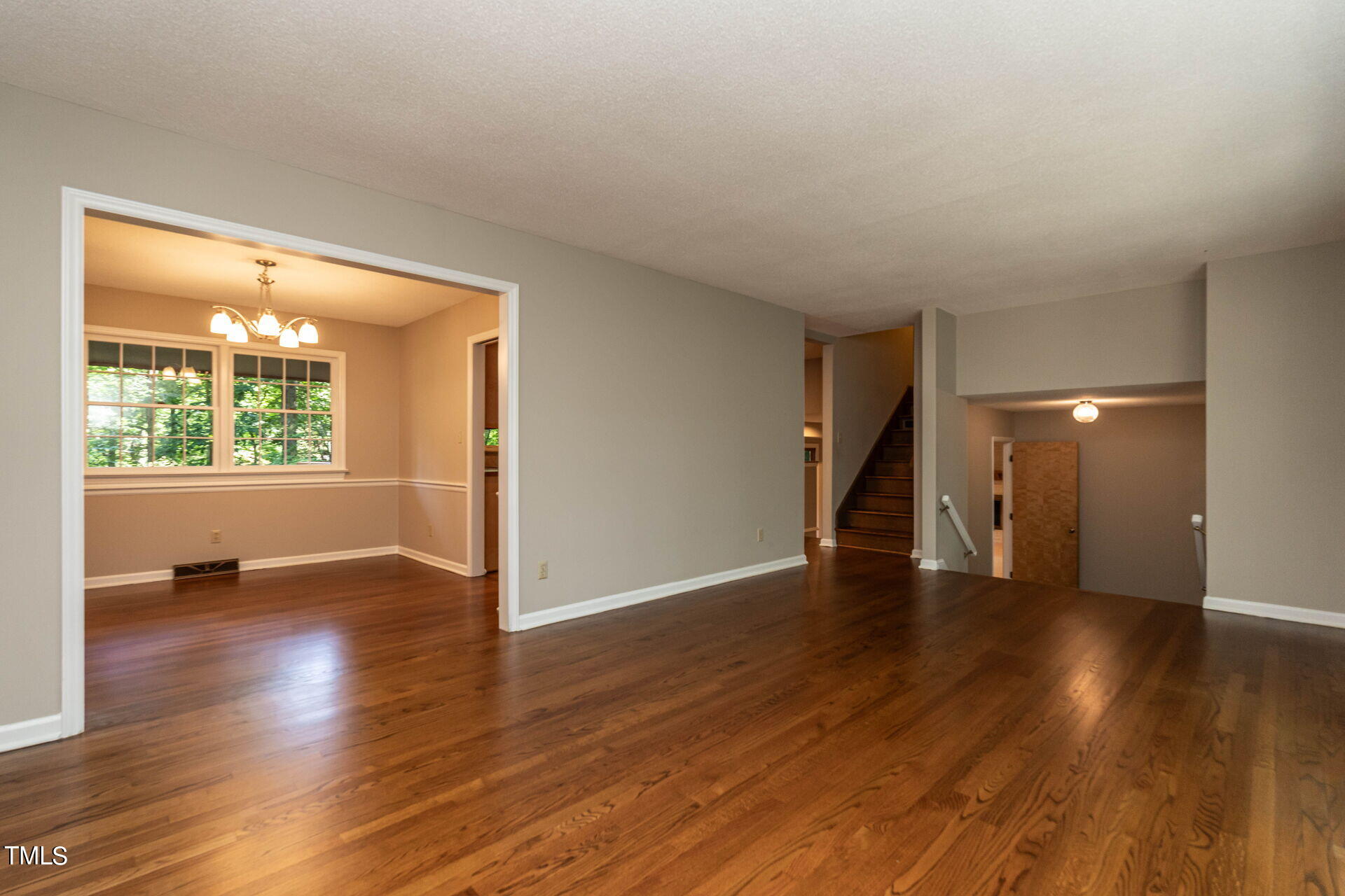 6604 Brandywine Road Raleigh, NC 27607 - Photo 19 of 46 wooden floor in an empty room with a window