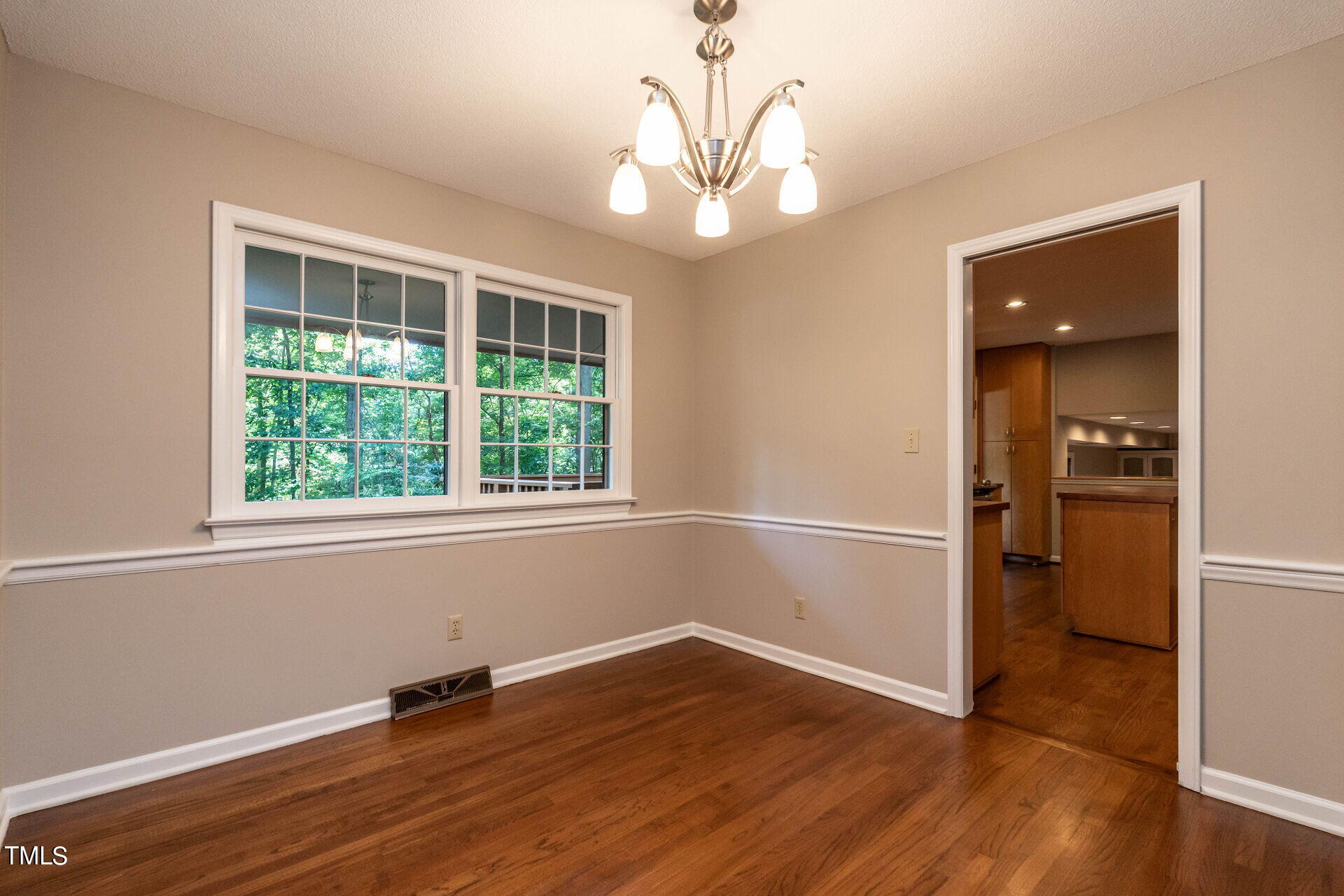 6604 Brandywine Road Raleigh, NC 27607 - Photo 20 of 46 wooden floor in an empty room with a window