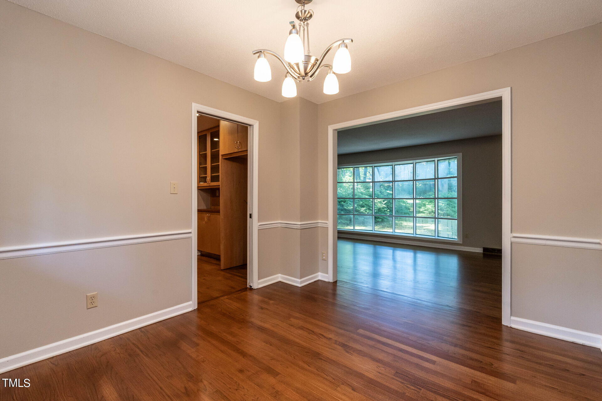 6604 Brandywine Road Raleigh, NC 27607 - Photo 21 of 46 a view of livingroom with hardwood floor and window
