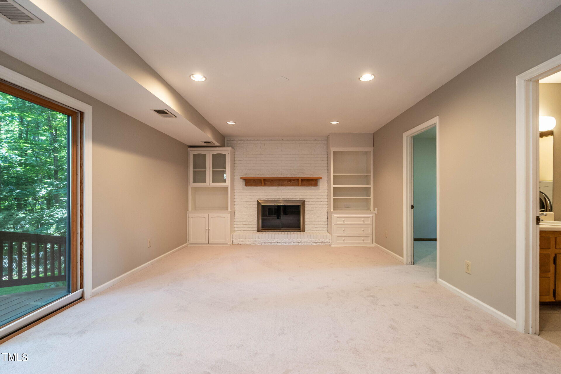 6604 Brandywine Road Raleigh, NC 27607 - Photo 27 of 46 a view of empty room with a fireplace