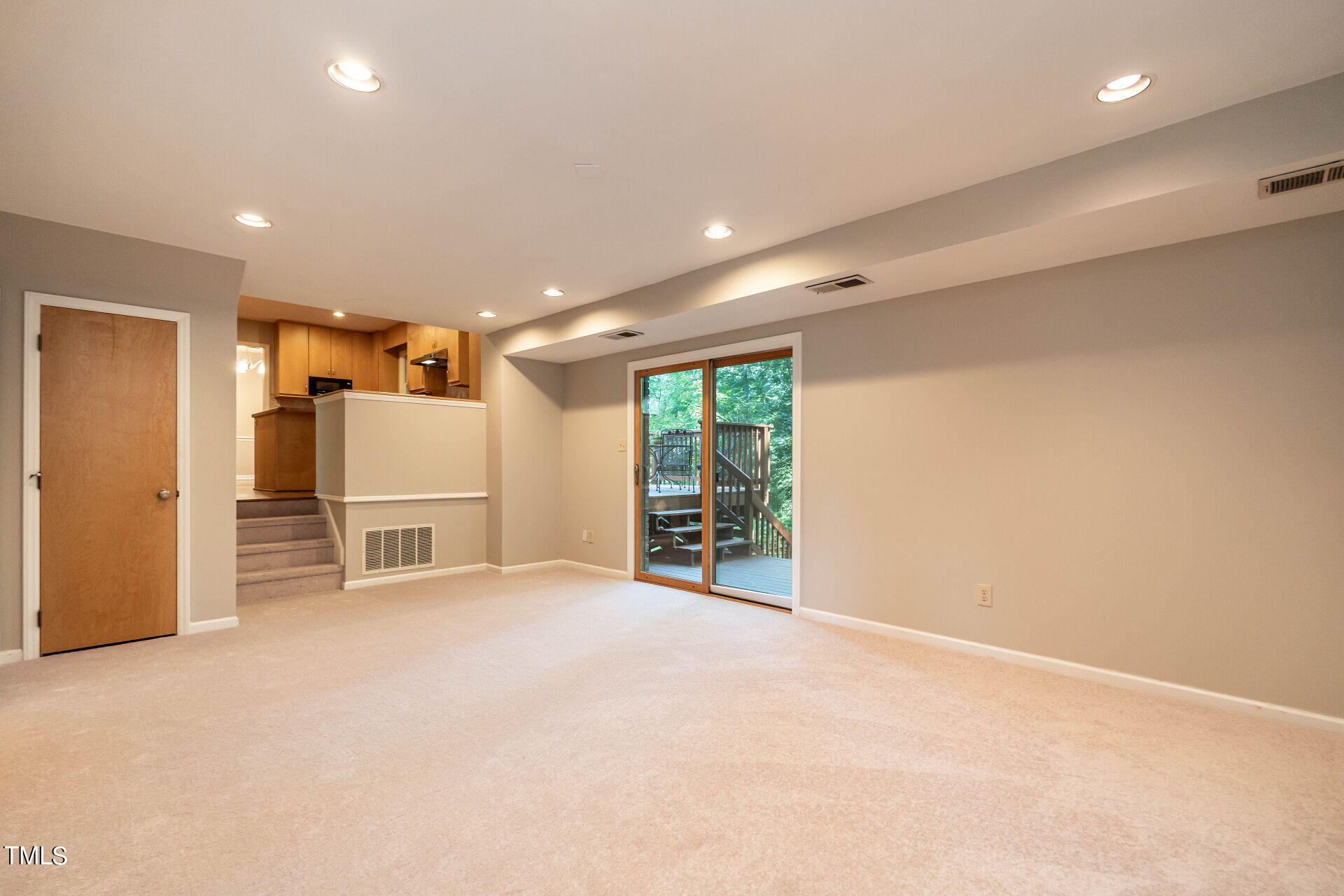 6604 Brandywine Road Raleigh, NC 27607 - Photo 28 of 46 an empty room with furniture and a kitchen