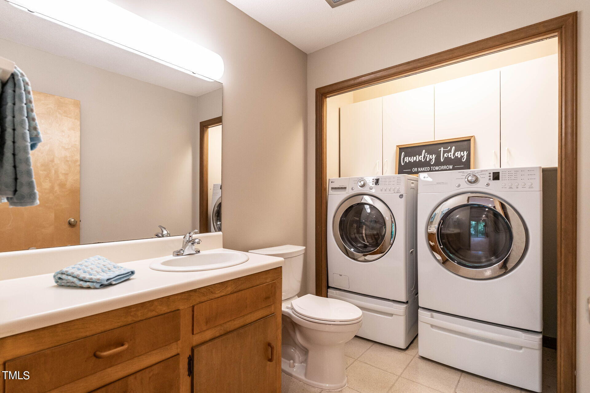 6604 Brandywine Road Raleigh, NC 27607 - Photo 30 of 46 a bathroom with a sink a toilet and a mirror