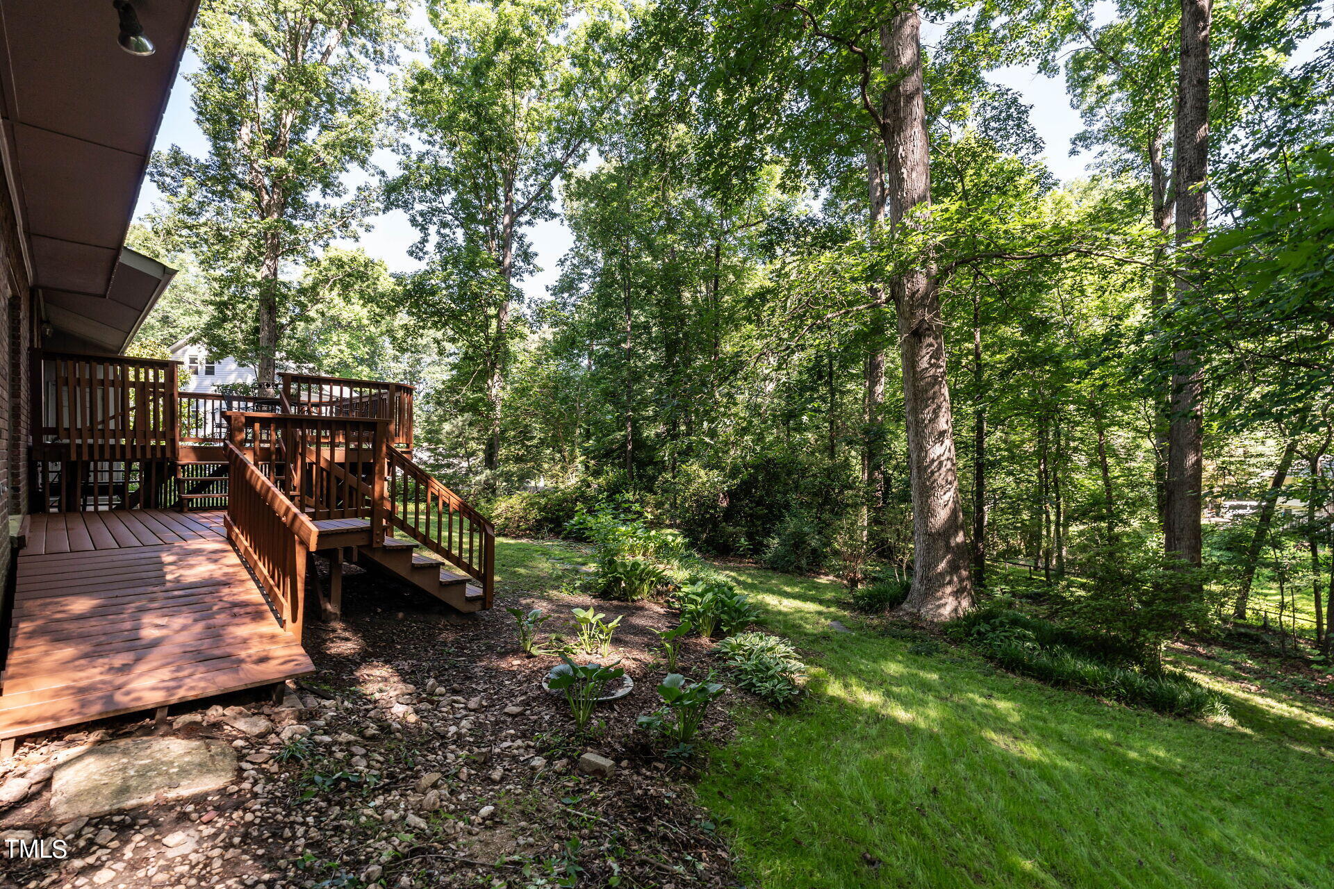 6604 Brandywine Road Raleigh, NC 27607 - Photo 36 of 46 a backyard of a house with lots of green space