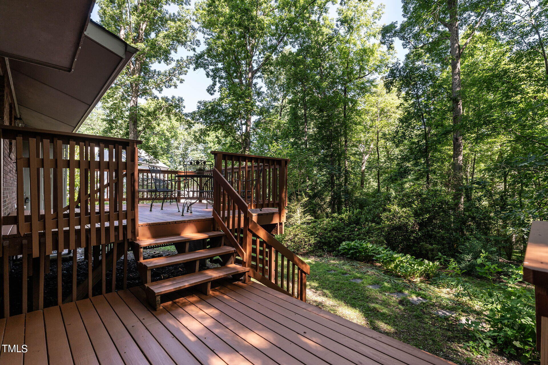 6604 Brandywine Road Raleigh, NC 27607 - Photo 37 of 46 a view of balcony with wooden floor and outdoor seating