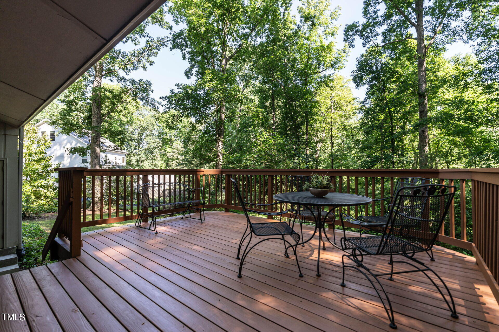 6604 Brandywine Road Raleigh, NC 27607 - Photo 38 of 46 a balcony with wooden floor table and chairs