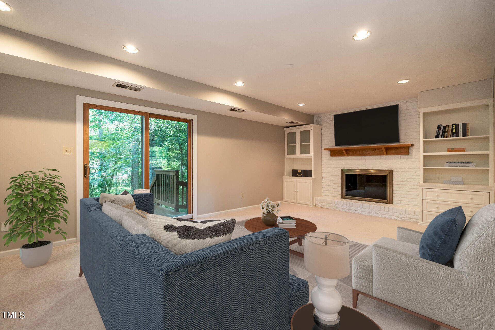 6604 Brandywine Road Raleigh, NC 27607 - Photo 6 of 46 a living room with furniture tv and a fireplace