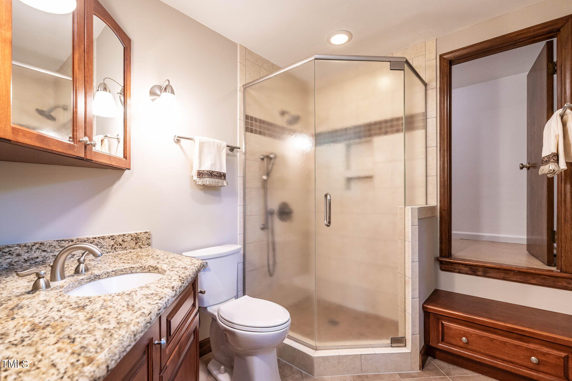 6604 Brandywine Road Raleigh, NC 27607 - Photo 10 of 46 a bathroom with a granite countertop sink toilet and shower