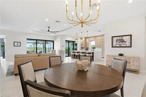 a room with a bed and a television