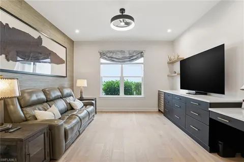 a spacious bedroom with a bed and a large window