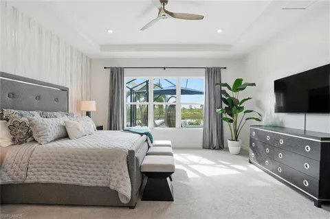 a bathroom with a double vanity sink and mirror with shower