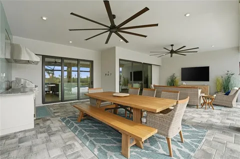 a kitchen with a table chairs and a stove