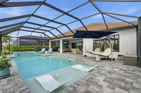 a view of a swimming pool with a patio