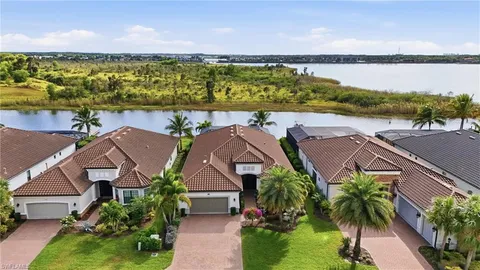 an aerial view of a house with outdoor space and street view