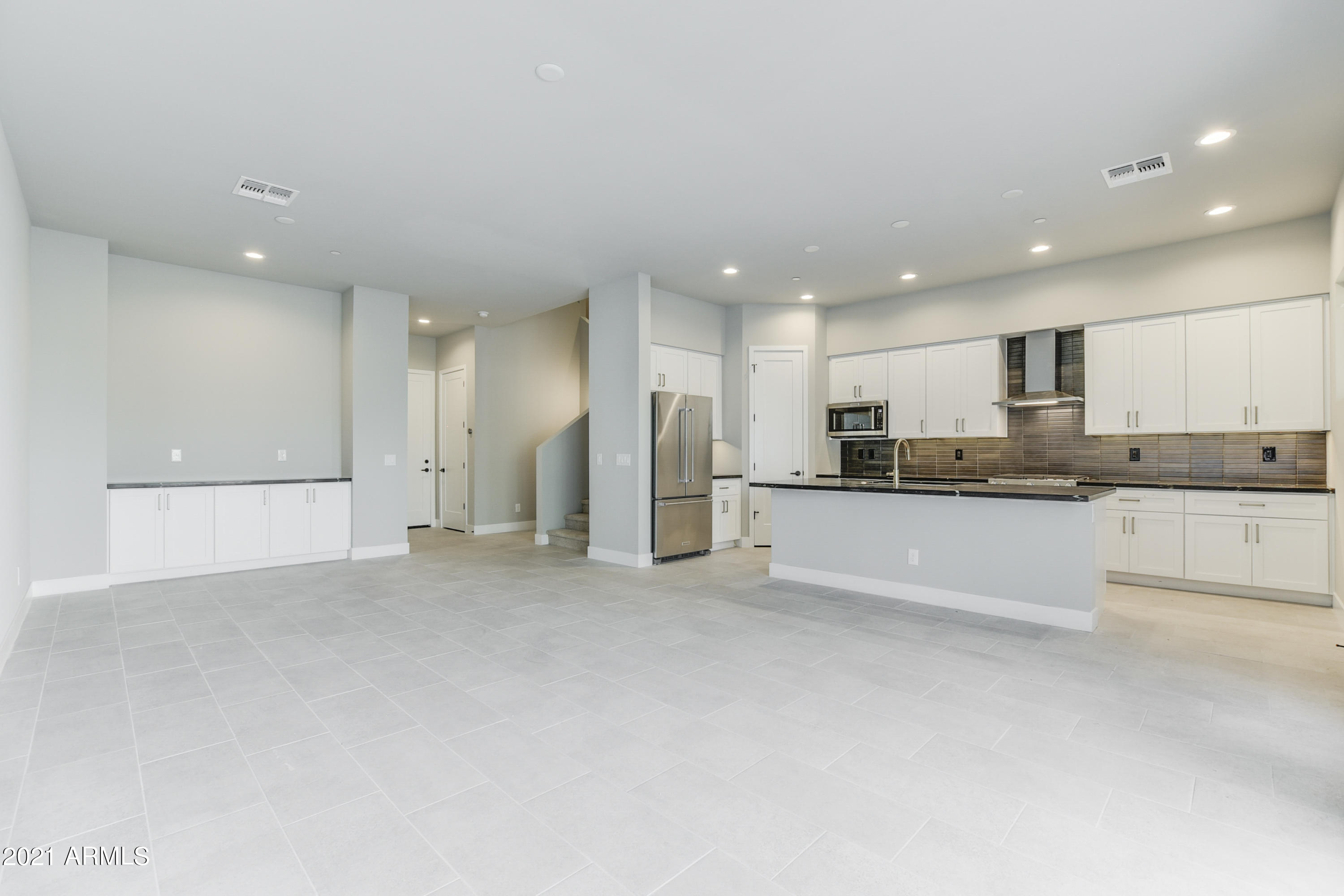 1111 East Missouri Avenue, Unit 3 Phoenix, AZ 85014 - Photo 23 of 24 a view of kitchen with refrigerator and white cabinets