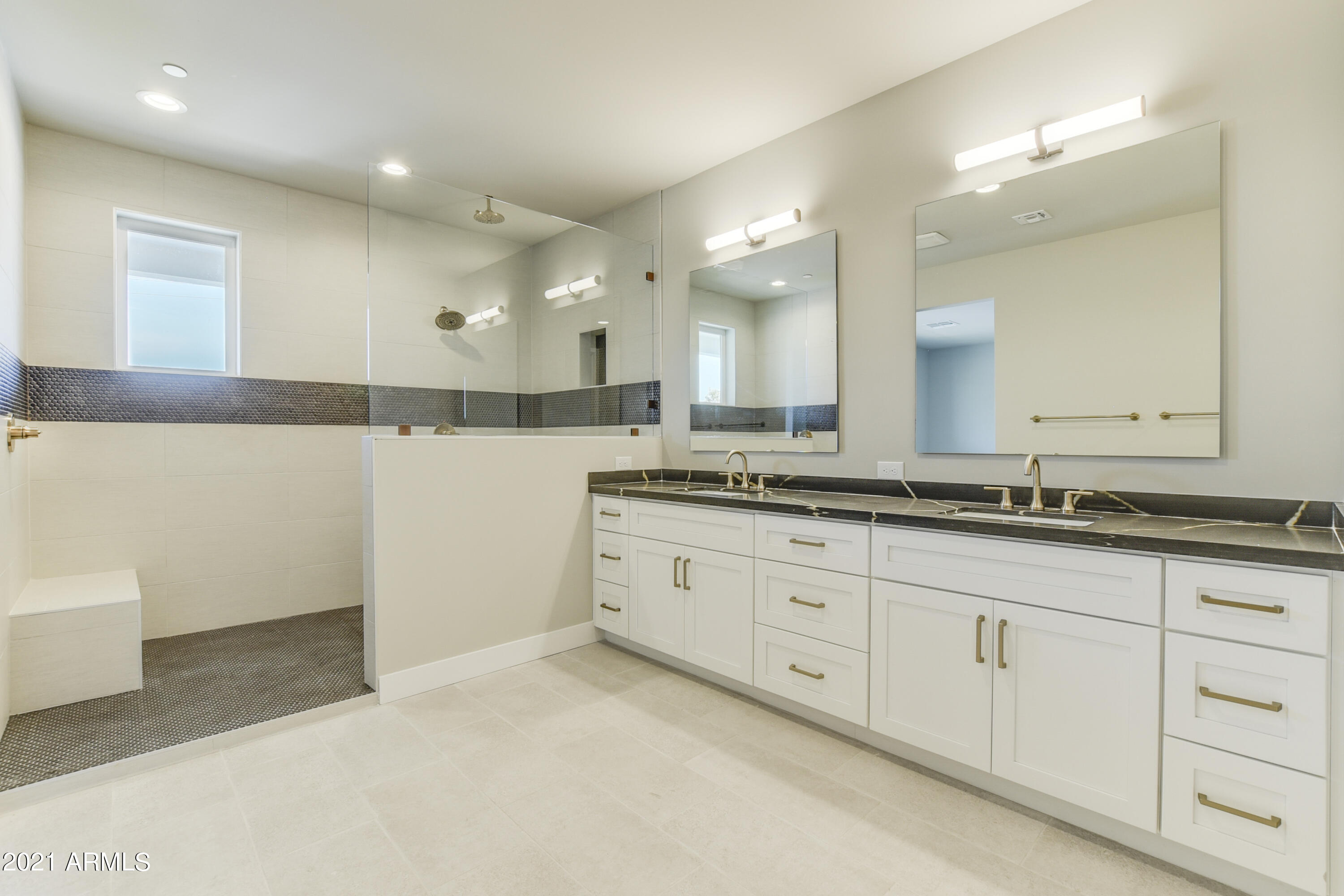 1111 East Missouri Avenue, Unit 3 Phoenix, AZ 85014 - Photo 14 of 24 a bathroom with a sink and a mirror