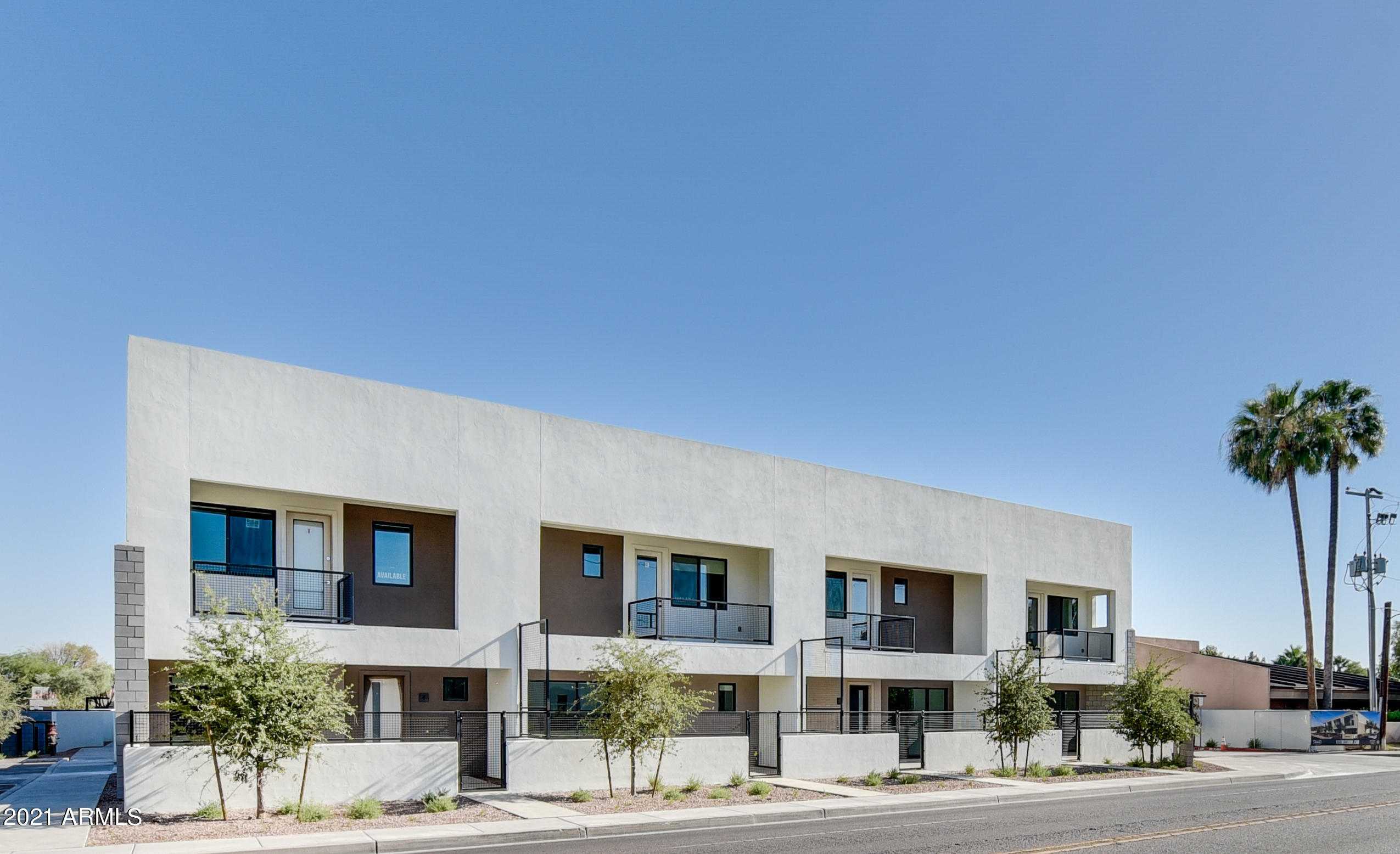 1111 East Missouri Avenue, Unit 3 Phoenix, AZ 85014 - Photo 20 of 24 a front view of multiple houses with yard