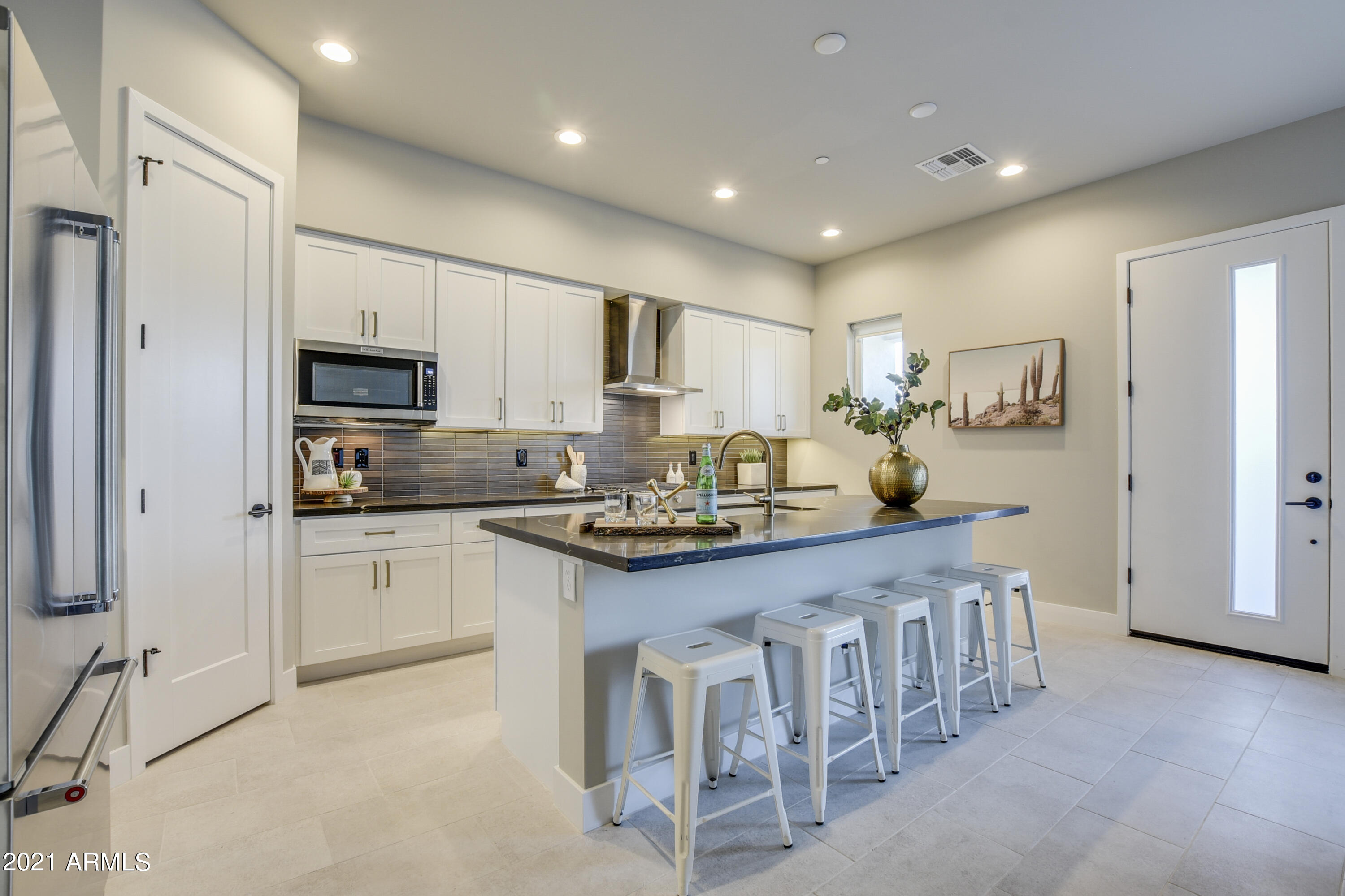 1111 East Missouri Avenue, Unit 3 Phoenix, AZ 85014 - Photo 5 of 24 a kitchen with counter top space cabinets and stainless steel appliances