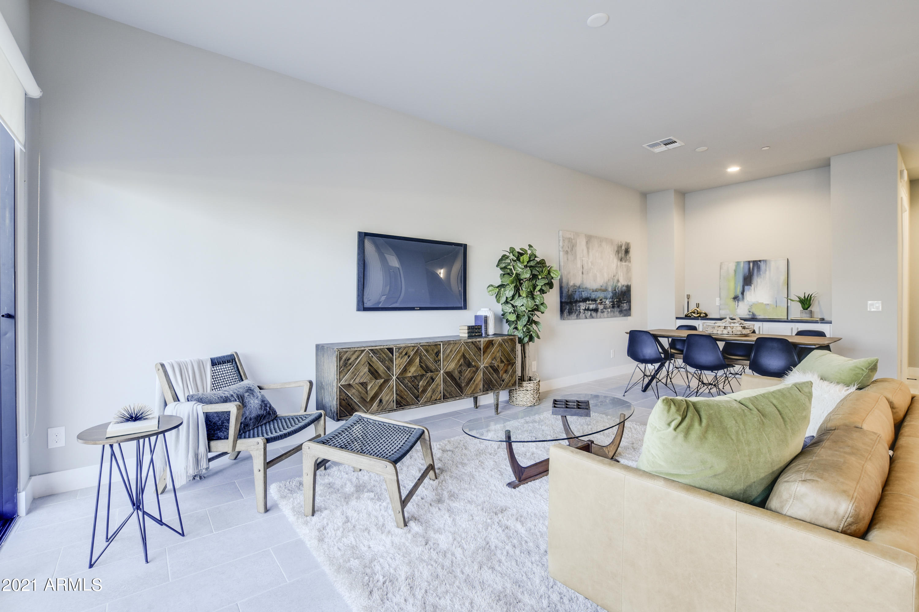 1111 East Missouri Avenue, Unit 3 Phoenix, AZ 85014 - Photo 8 of 24 a living room with furniture and a wooden floor