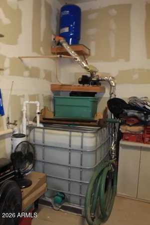 a bathroom with a washing machine and other items