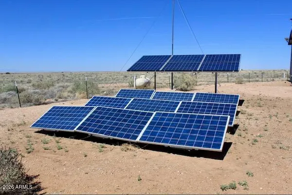 a view of roof deck with wooden fence