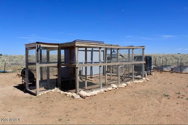 a view of a house with wooden deck