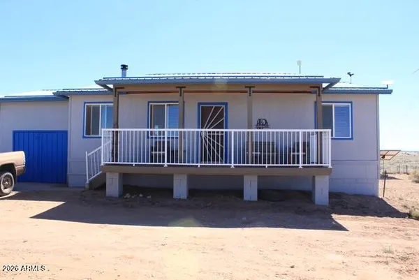 a view of a roof deck with a table and chairs