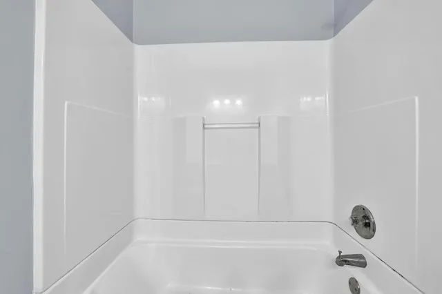 a bathroom with a bathtub