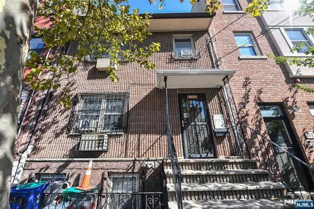 a bedroom with a bed and a mirror