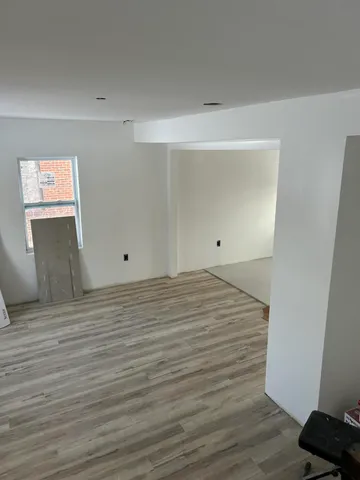 a bathroom with a tub sink and vanity