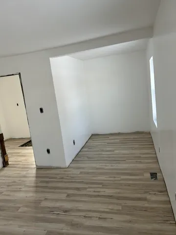 view of bathroom with bathtub and window