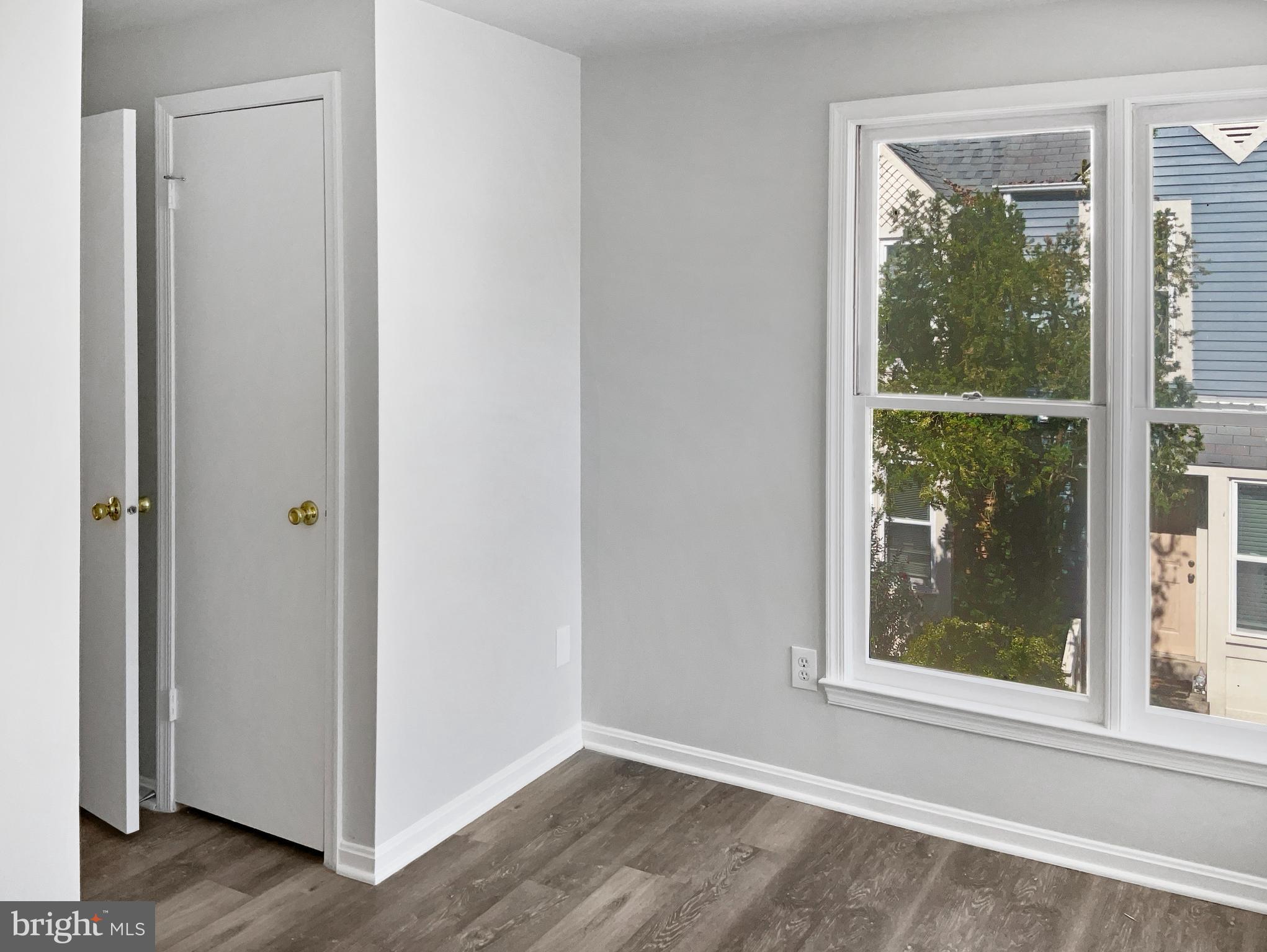 11184 Silentwood Lane Reston, VA 20191 - Photo 17 of 26 a view of a small space with wooden floor and a window
