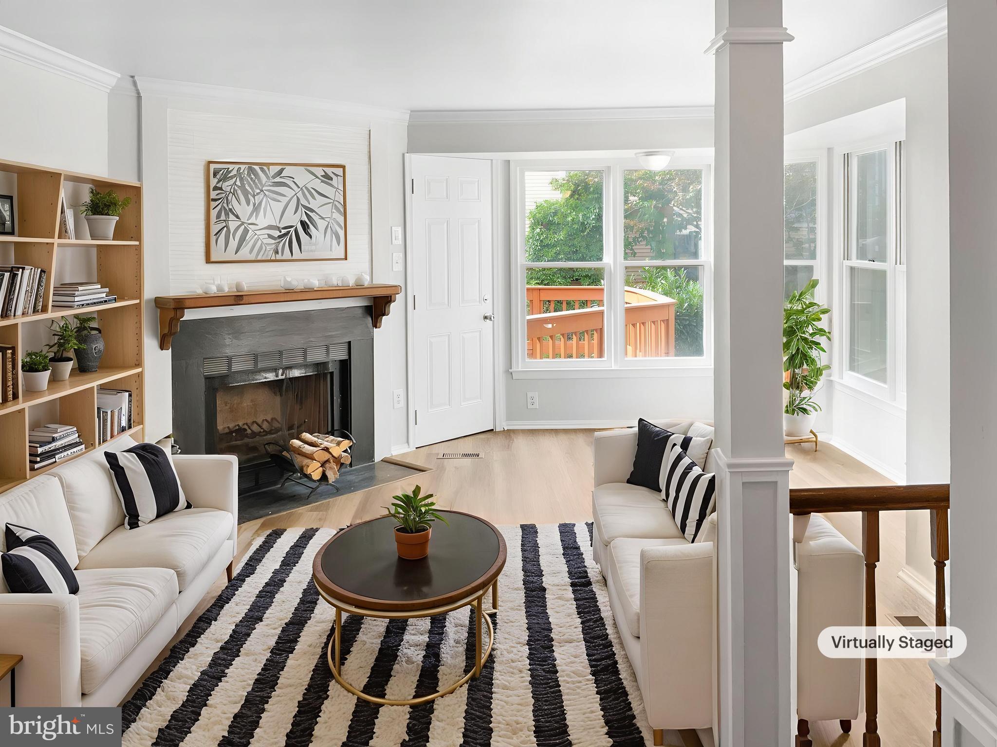 11184 Silentwood Lane Reston, VA 20191 - Photo 2 of 26 a living room with furniture and a fireplace