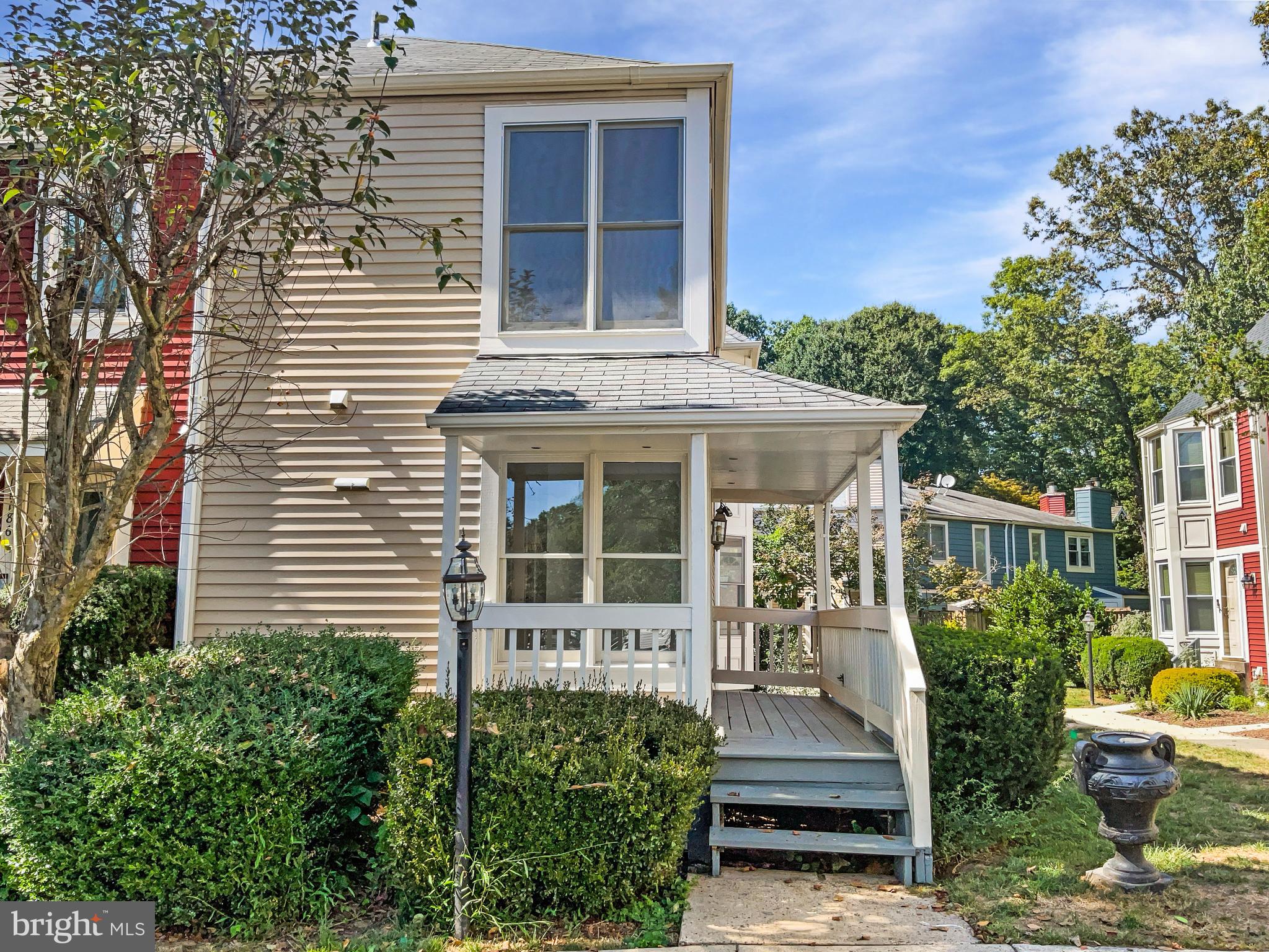 11184 Silentwood Lane Reston, VA 20191 - Photo 9 of 26 a front view of a house with a garden