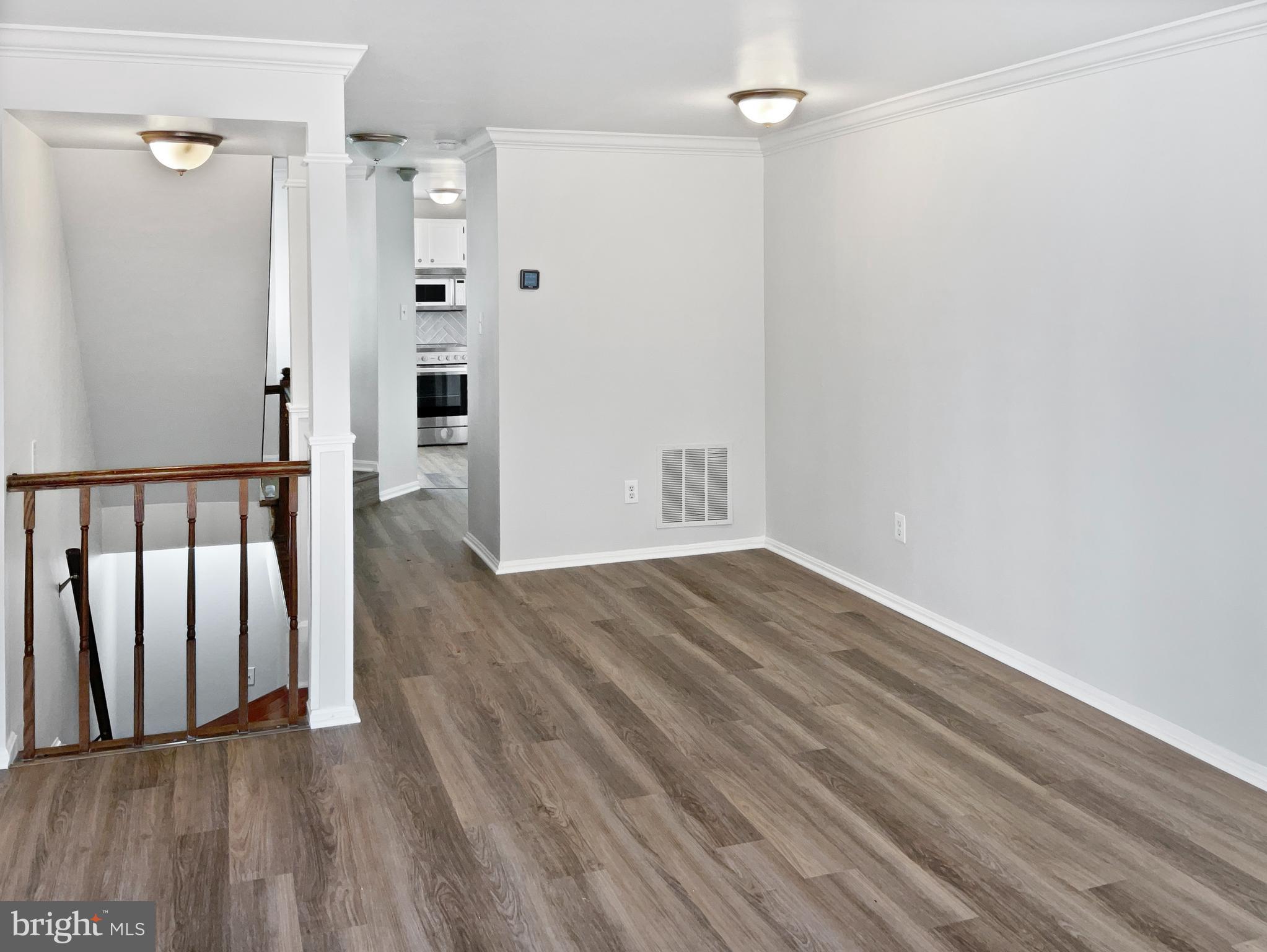 11184 Silentwood Lane Reston, VA 20191 - Photo 10 of 26 a view of hallway with wooden floor