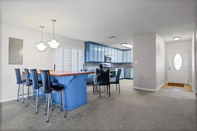 a view of a livingroom with furniture wooden floor and a window