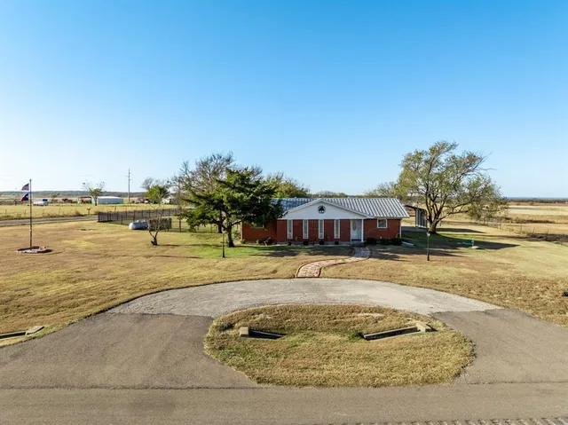 a view of a garden with a lake view