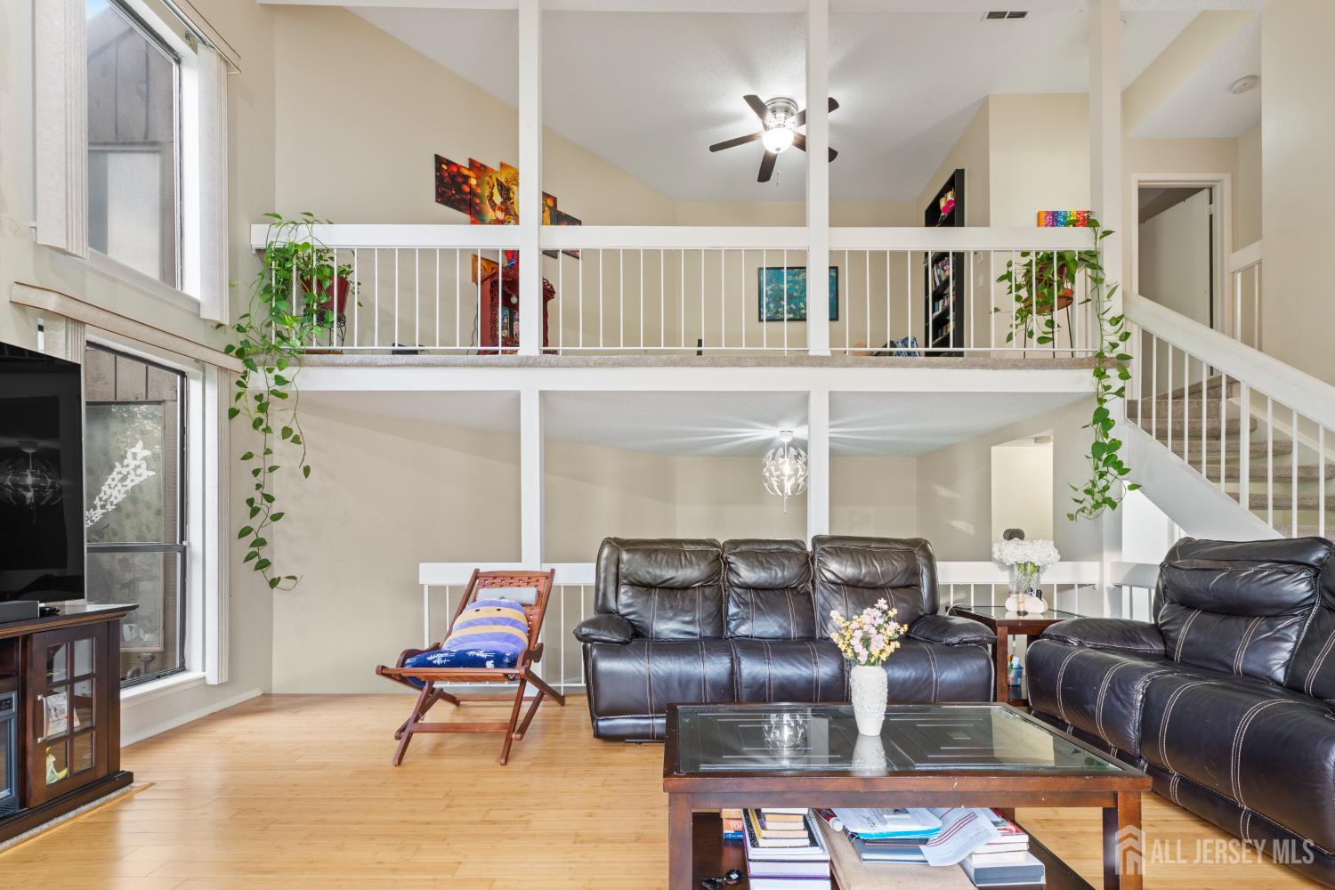 348 Westgate Drive Edison, NJ 08820 - Photo 12 of 43 a living room with furniture a flat screen tv and a fireplace