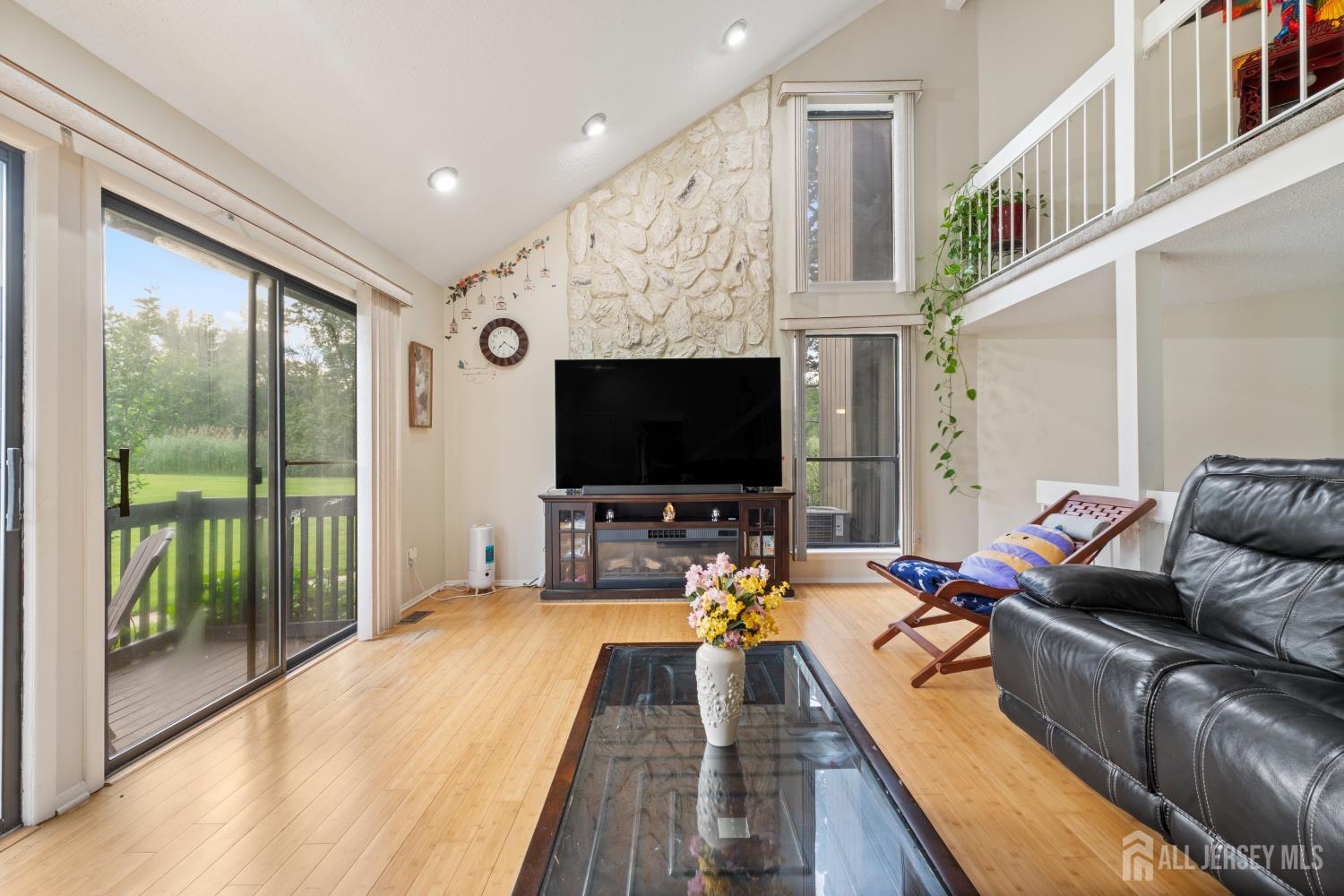 348 Westgate Drive Edison, NJ 08820 - Photo 15 of 43 a living room with furniture and a flat screen tv