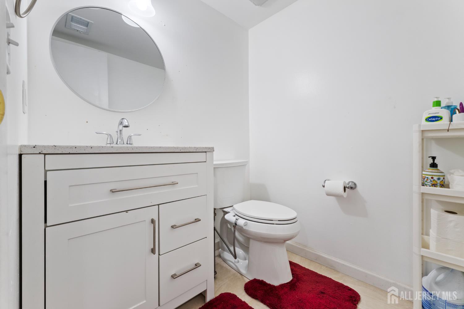 348 Westgate Drive Edison, NJ 08820 - Photo 23 of 43 a bathroom with a sink toilet and a mirror