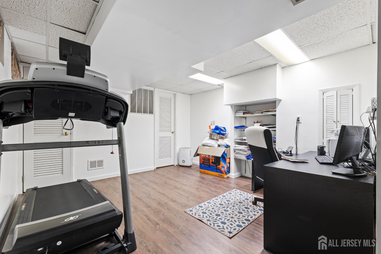 348 Westgate Drive Edison, NJ 08820 - Photo 26 of 43 a view of a workspace with furniture and a window