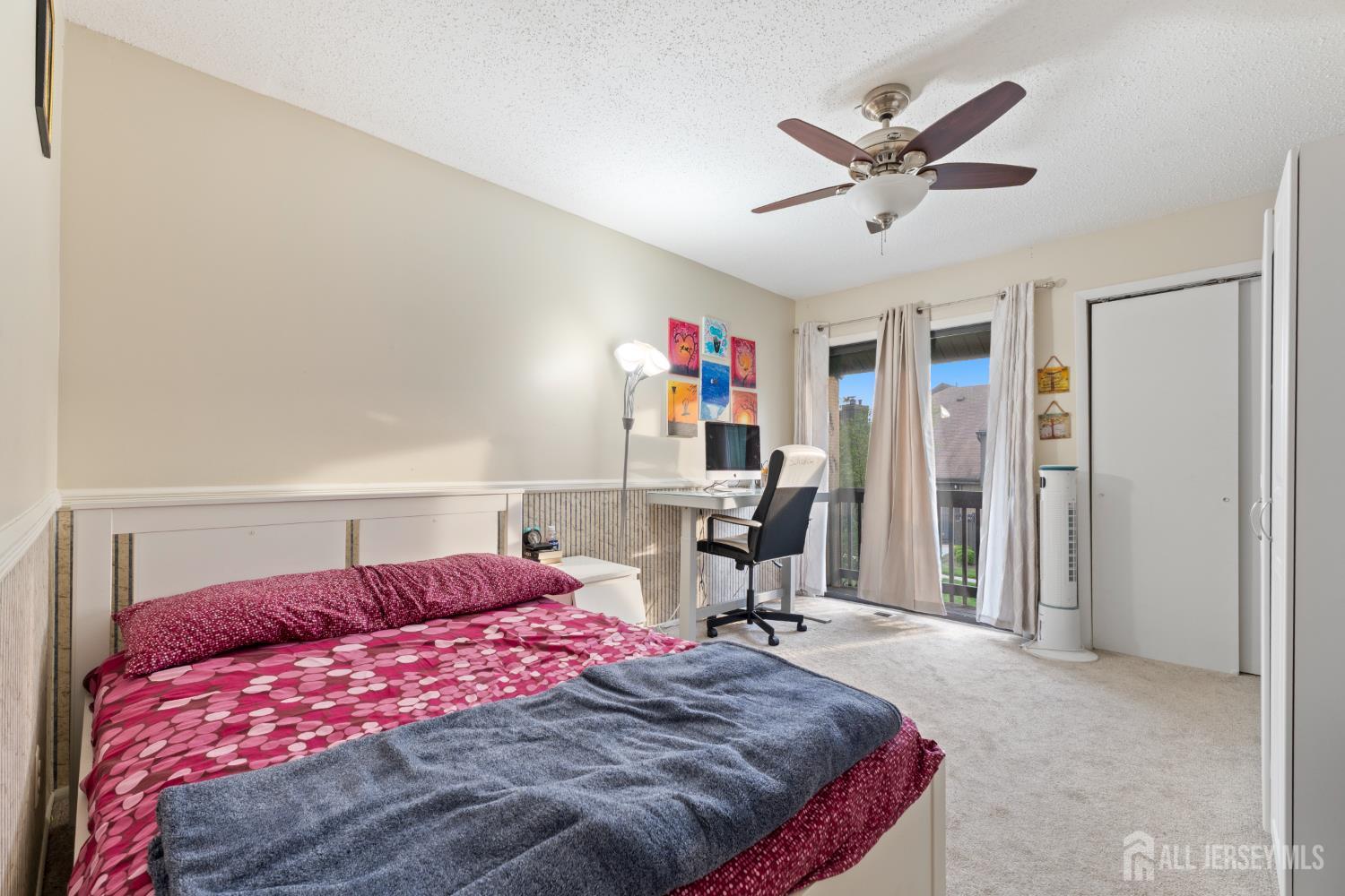 348 Westgate Drive Edison, NJ 08820 - Photo 30 of 43 a bedroom with a bed and a chandelier