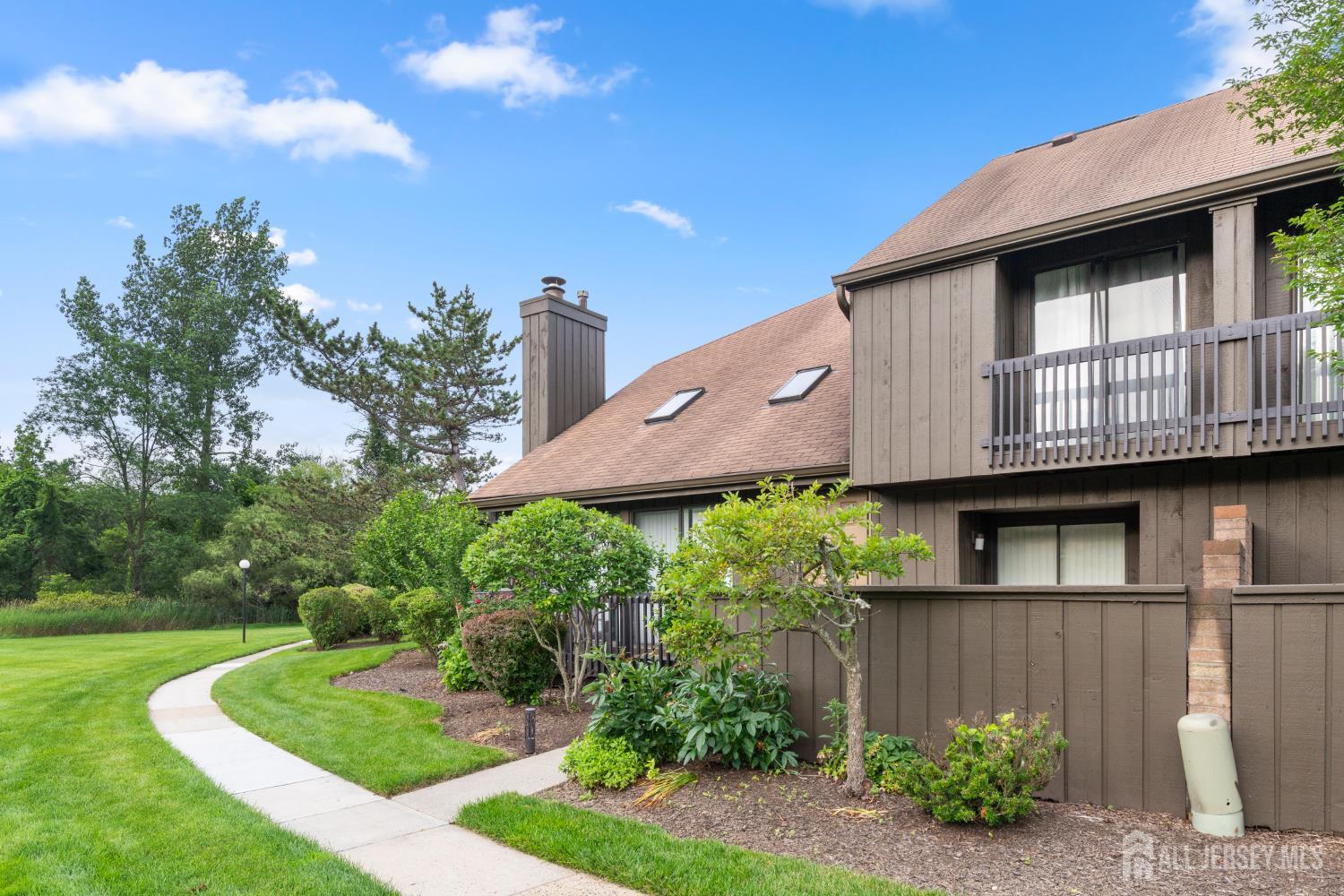 348 Westgate Drive Edison, NJ 08820 - Photo 3 of 43 a front view of a house with garden