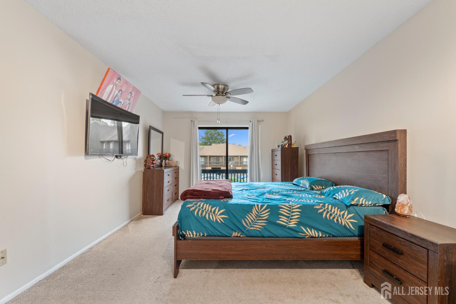 348 Westgate Drive Edison, NJ 08820 - Photo 36 of 43 a bedroom with a bed and a dresser