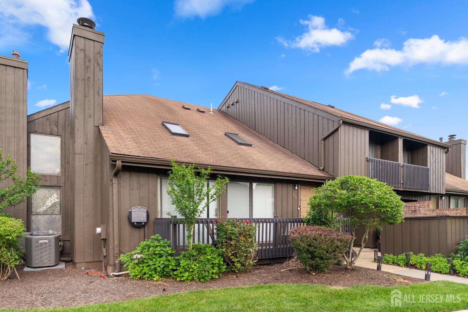 348 Westgate Drive Edison, NJ 08820 - Photo 5 of 43 a front view of a house with garden