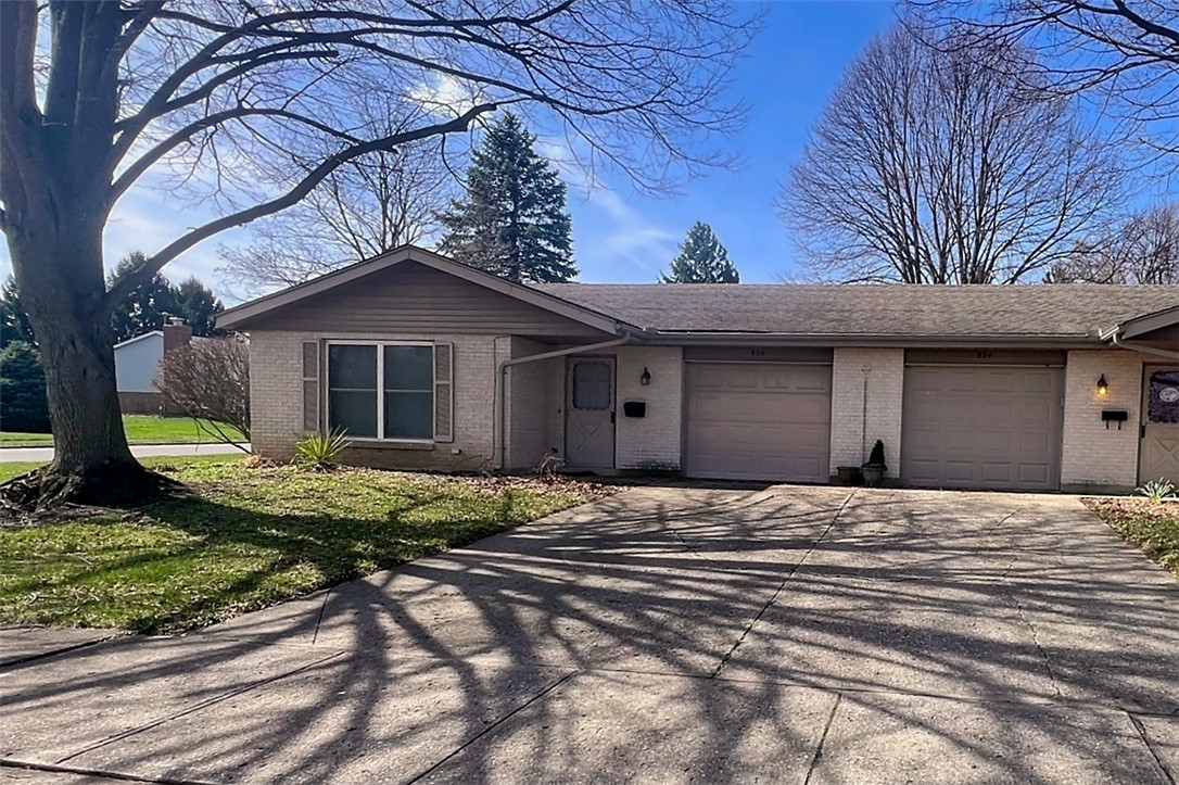 920 North Dorset Road, Unit 920 Troy, OH 45373 - Photo 18 of 18 This charming home offers convenient (one car) garage parking (on the left) and a well-maintained exterior.