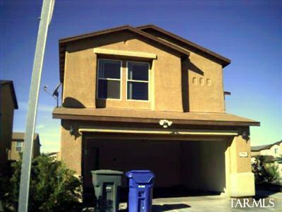 5740 South Manta Ray Road Tucson, AZ 85706 - Photo 1 of 5 a front view of a house with glass windows