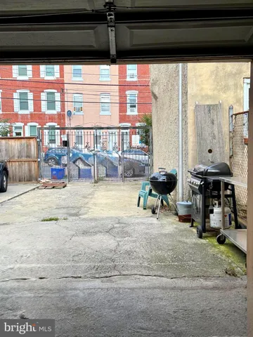 a view of a living room with furniture and a large window