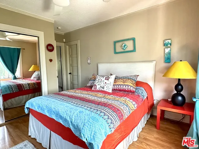 a view of a patio with table and chairs potted plants