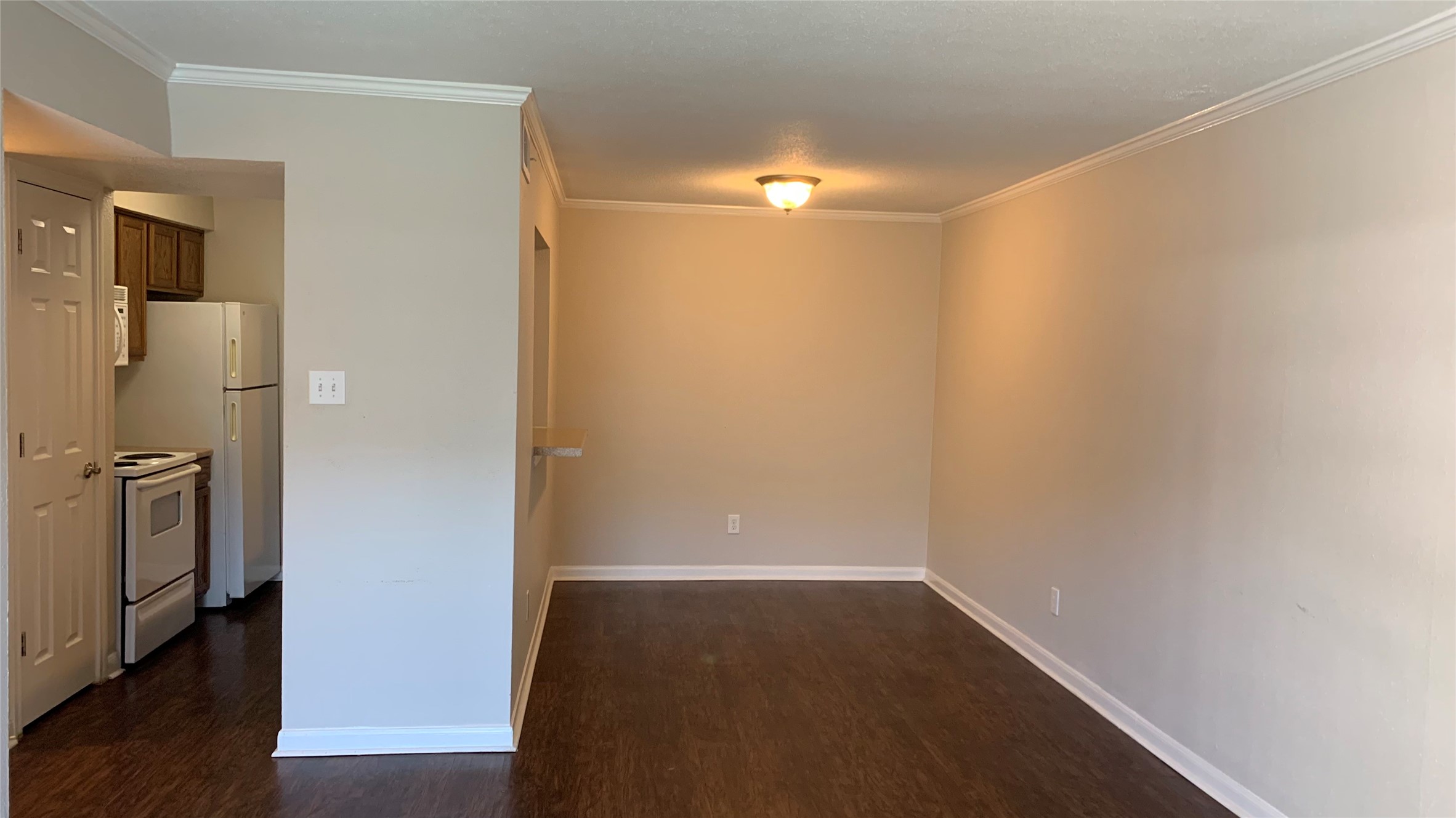 7315 Brompton Street, Unit 247A Houston, TX 77025 - Photo 5 of 8 a view of empty room with wooden floor