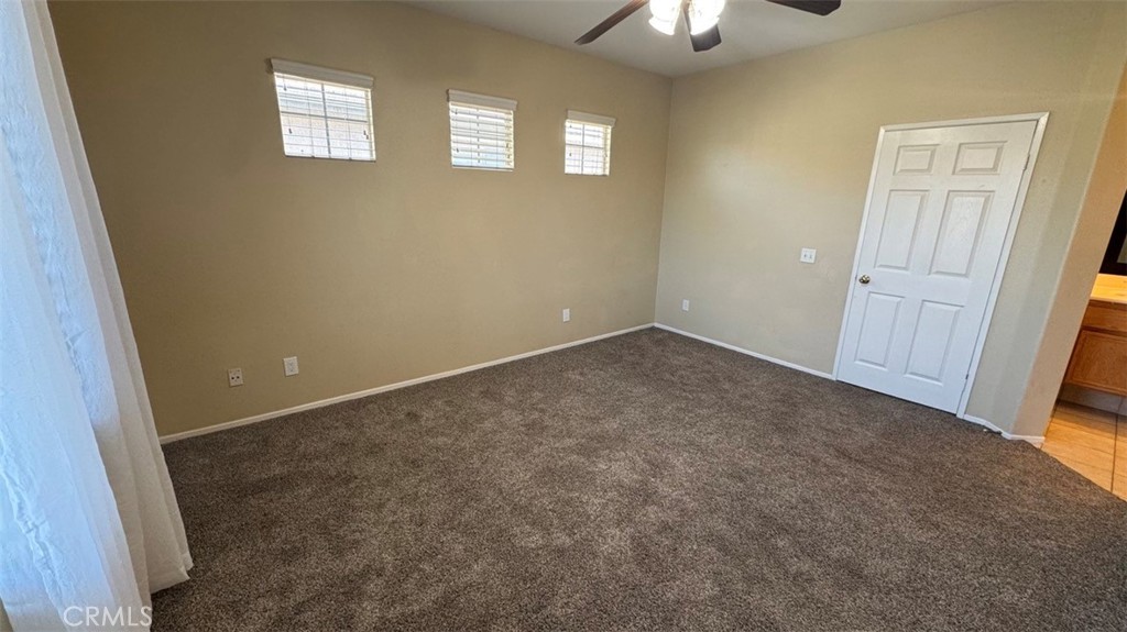11332 Riverbury Court Riverside, CA 92505 - Photo 15 of 15 an empty room with windows and closet